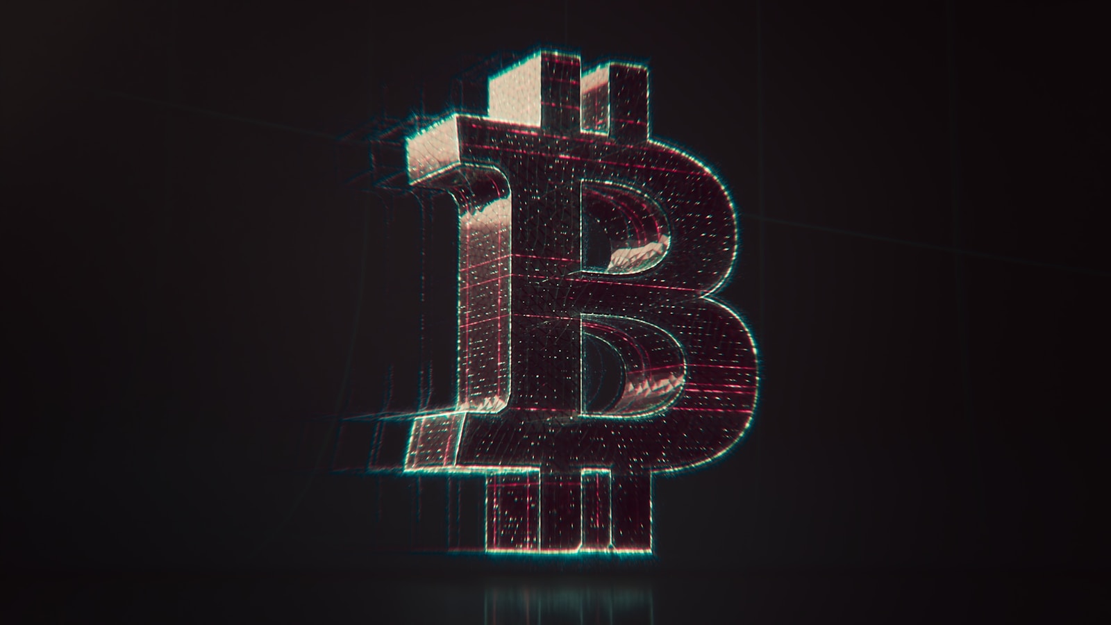 A shiny bitcoin logo on a black background