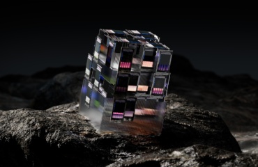 a cube shaped building on a rock