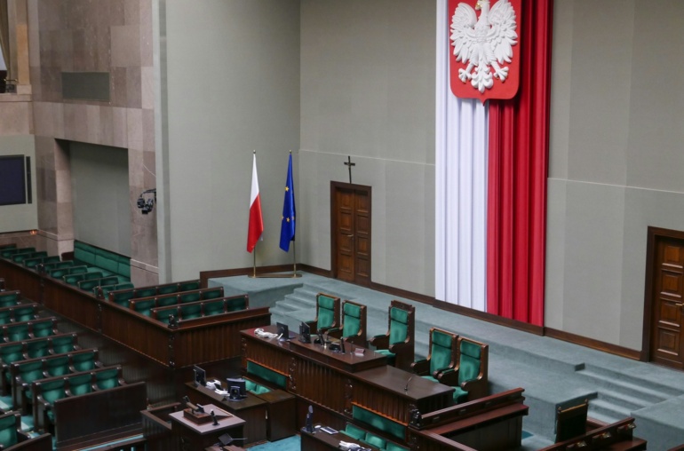 red white and blue flag on white wall