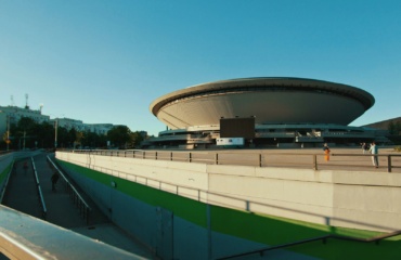green and white stadium under blue sky during daytime