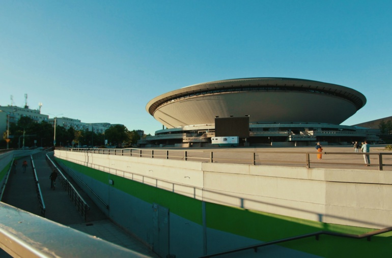 green and white stadium under blue sky during daytime