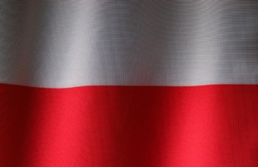 a close up of a red and white curtain