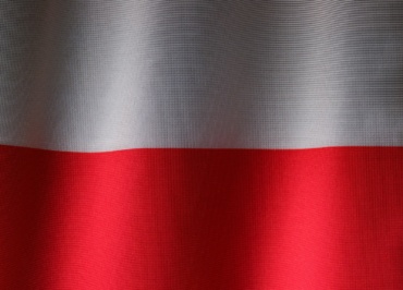 a close up of a red and white curtain