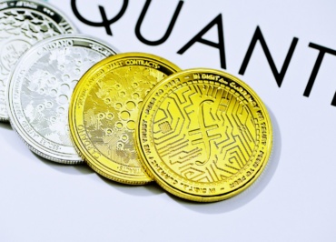 a close up of five different colored coins