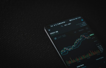 black android smartphone on black textile