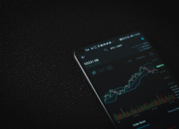 black android smartphone on black textile